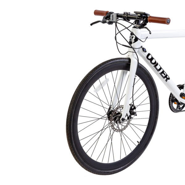 Front wheel of the Oolter Torm white electric bicycle with disc brakes and thin urban tires.