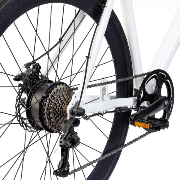 Close-up of Oolter Torm white electric bicycle’s rear wheel with motor hub and gear cassette.