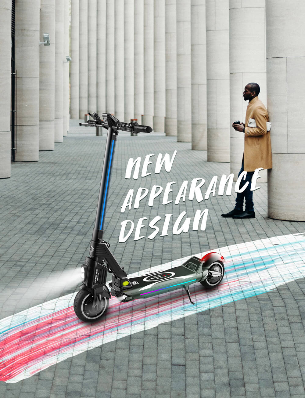 Dualtron Popular electric scooter with illuminated front light and colorful LED deck lighting displayed on a modern city walkway. A man in a beige coat stands in the background among tall concrete columns.