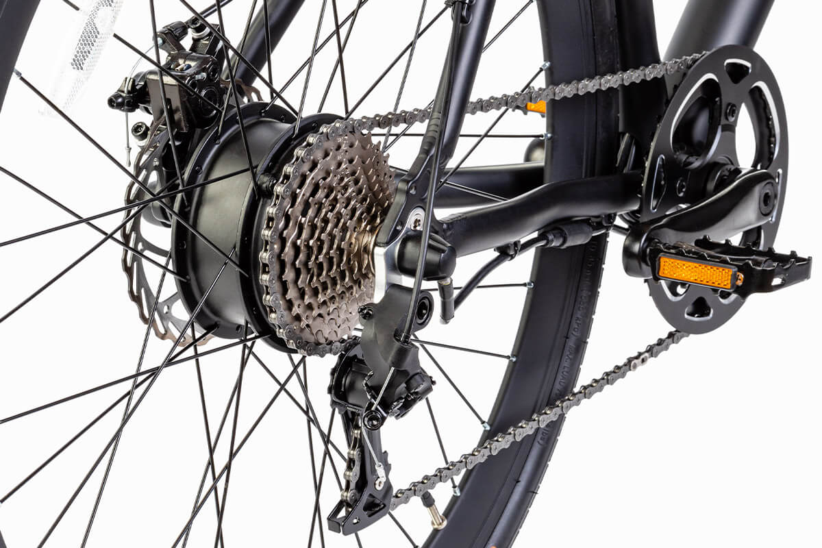 Close-up of the rear gear system and torque-assist motor on a black Oolter Torm e-bike, showing chain and cassette.