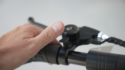 Gif of Electric scooter Gpad Joyride handlebar and thumb ringing the bell