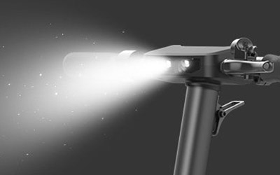 Close-up image of Electric scooter Inmotion S1 bright led front lights.