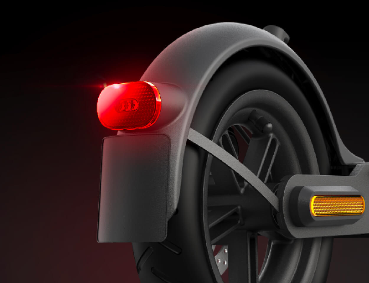 Close-up image of Electric scooter Xiaomi S1 rear wheel and brake light shining.