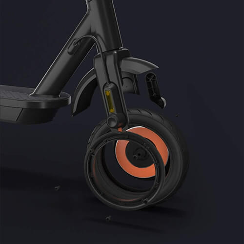 Close-up view of the front wheel of Inmotion Climber electric scooter showing the tire, rim, and suspension fork with part of the wheel assembly separated to display the internal structure and components.