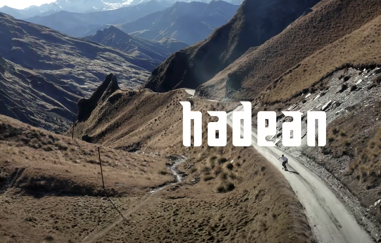 Video thumbnail of Evolve Hadean Bamboo Street electric skateboard rider descending a scenic mountain road