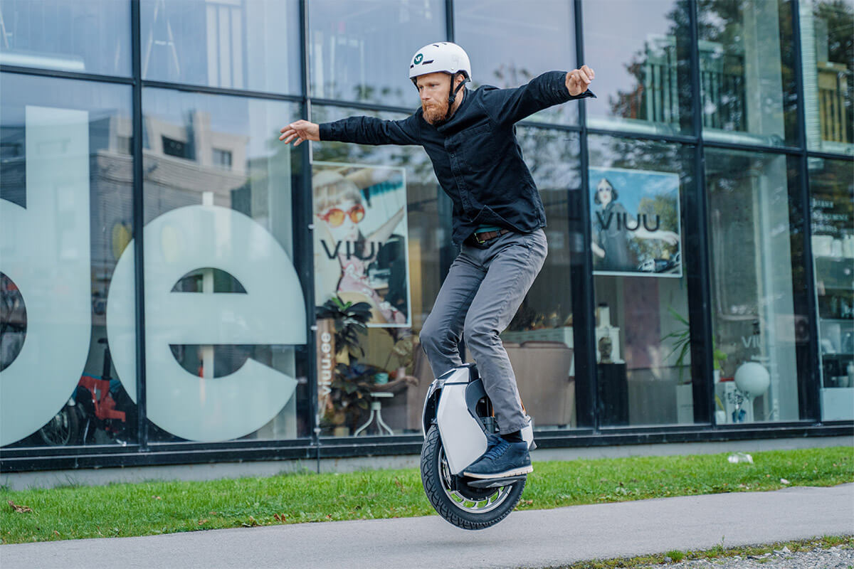 Man jumping with Kingsong S18 electric unicycle, demonstrating agility and off-road performance