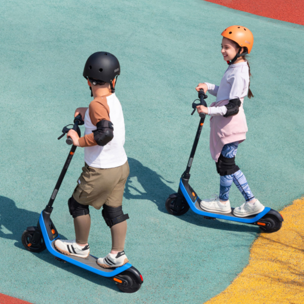 Children riding the electric scooter Segway C2 Lite on a smooth path, highlighting kid-friendly use and playful outdoor mobility.