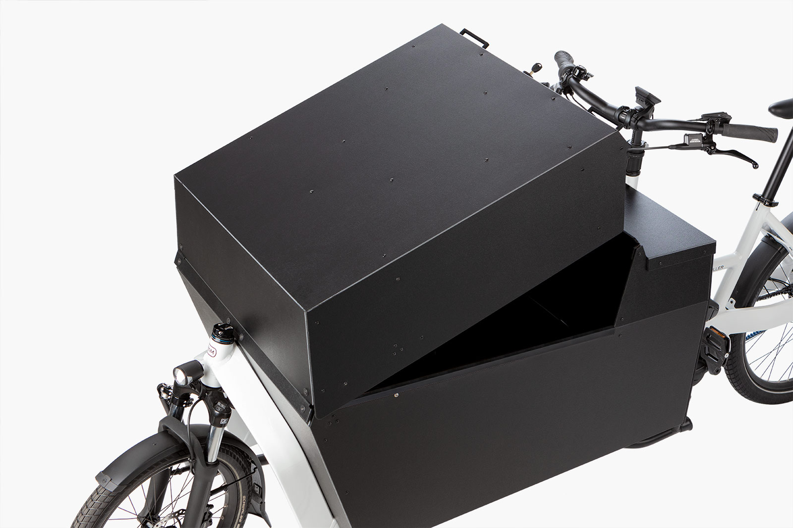 Top view of white Riese & Müller Transporter 85 electric cargo bike with open front-loading box.