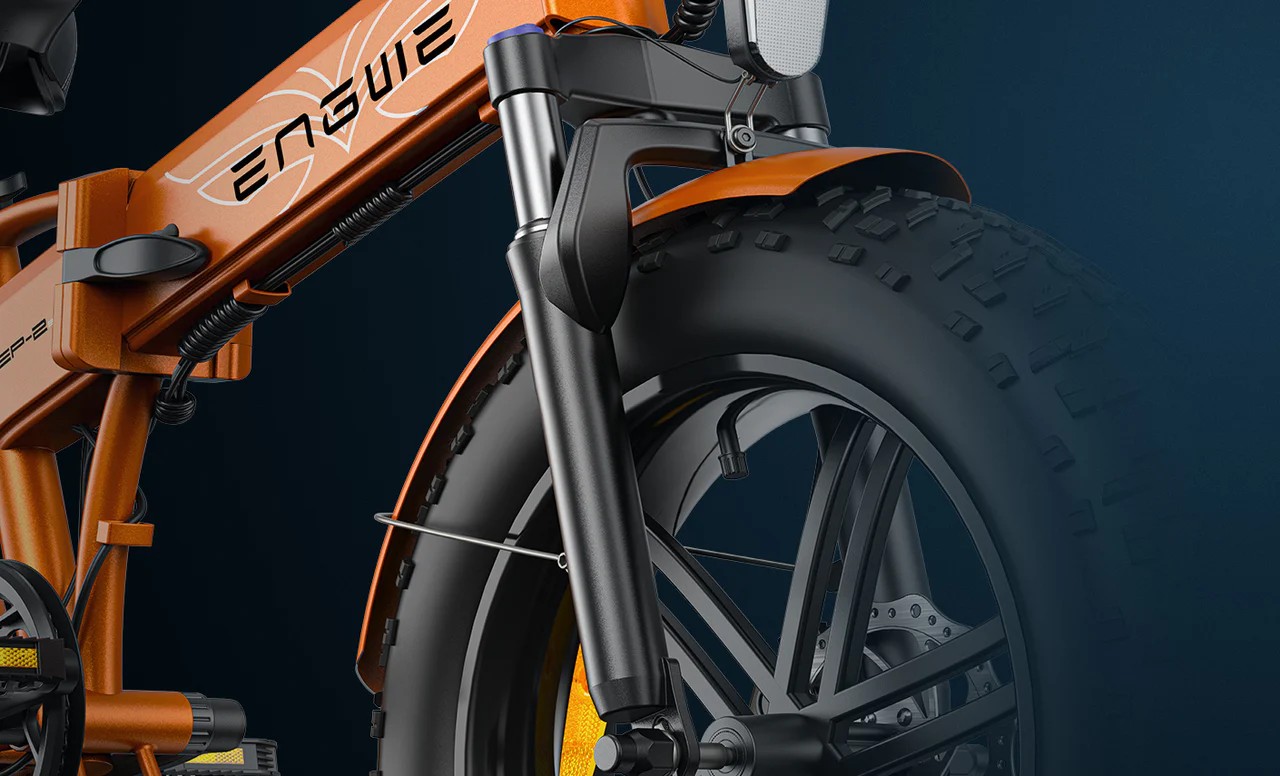 Close-up of the orange Engwe EP-2 Boost electric bicycle's front suspension.