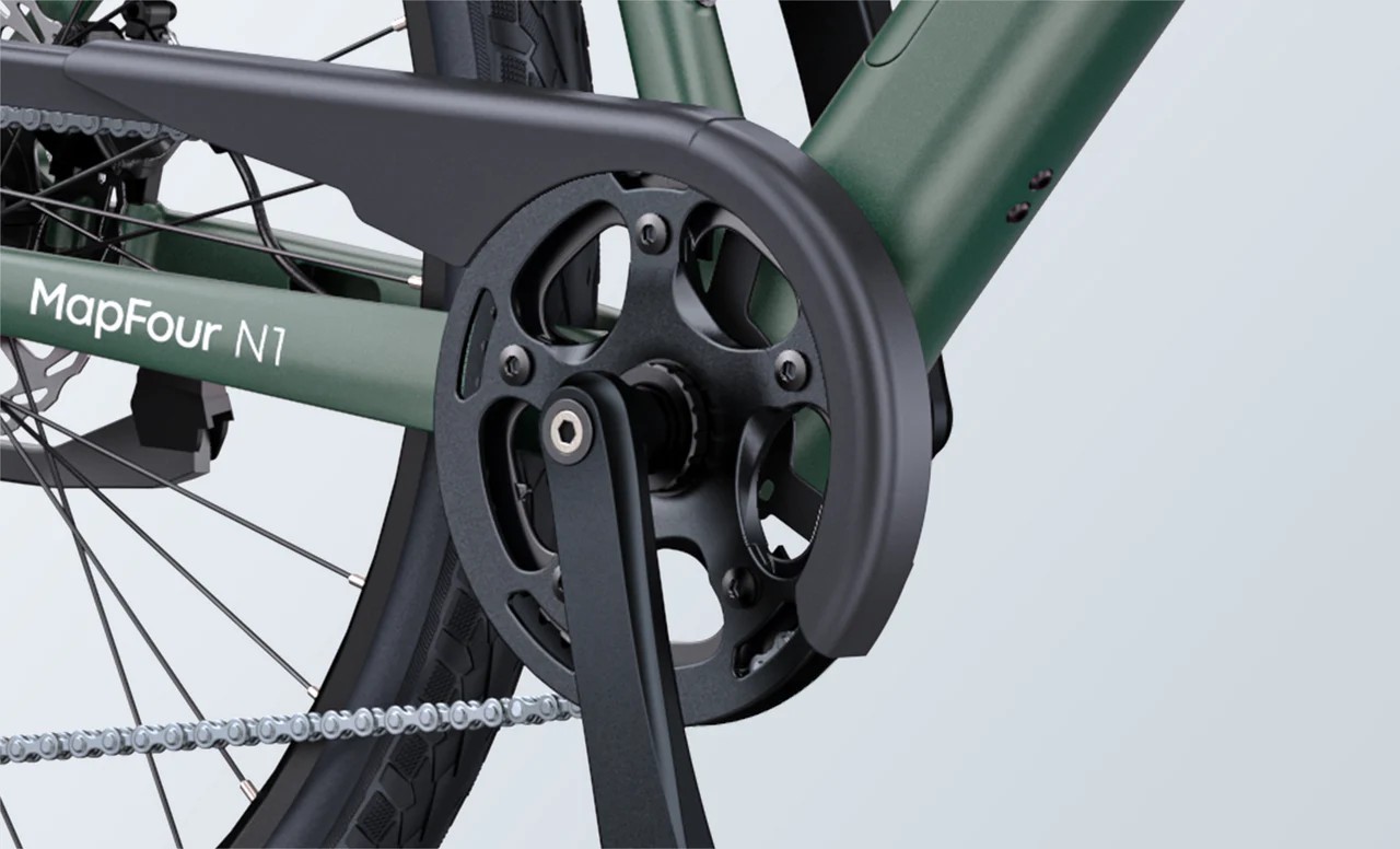 Close-up of the green Engwe Mapfour N1 Air electric bicycle's torque sensor.