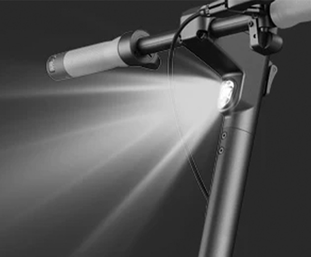 Close-up of the Inmotion Air electric scooter's front headlight.