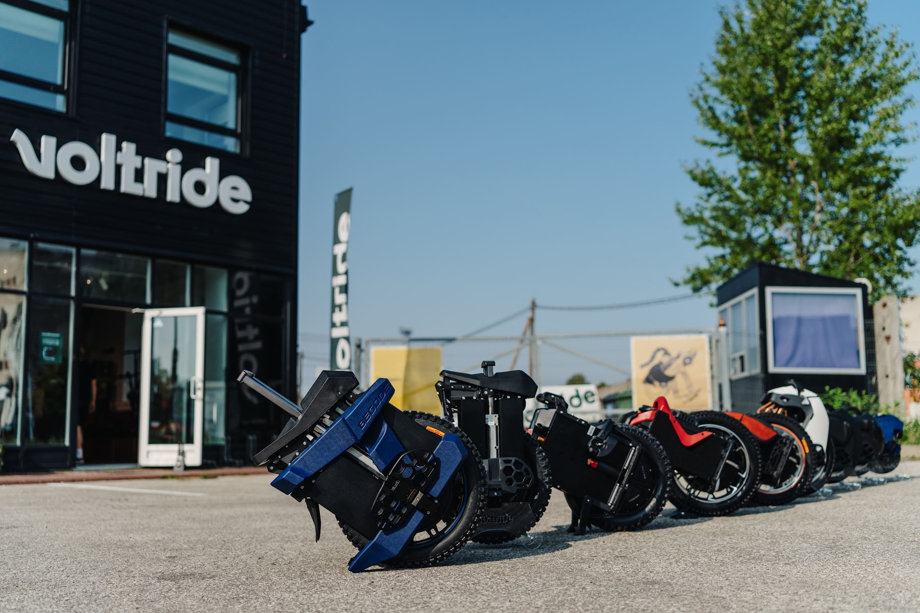 Electric unicycles lined up outside Voltride store