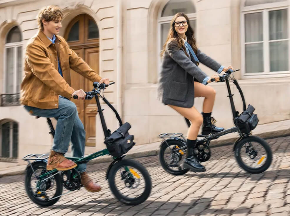 Two riders enjoying Engwe Zip folding electric bicycles on a cobblestone street in a historic city center.