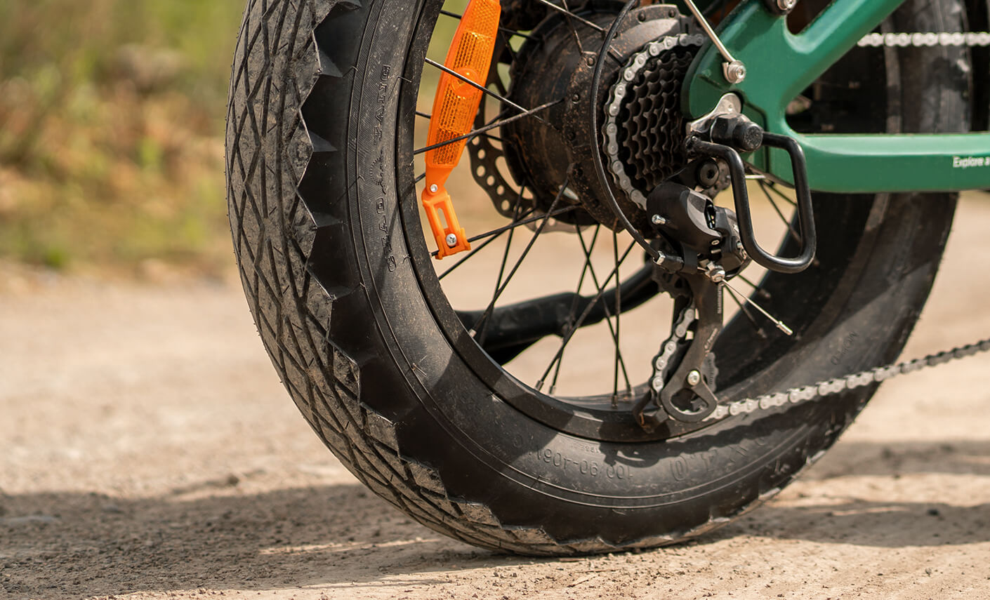 Close-up view of the Engwe EP-2 3.0 Boost forest green electric bike's fat tires.