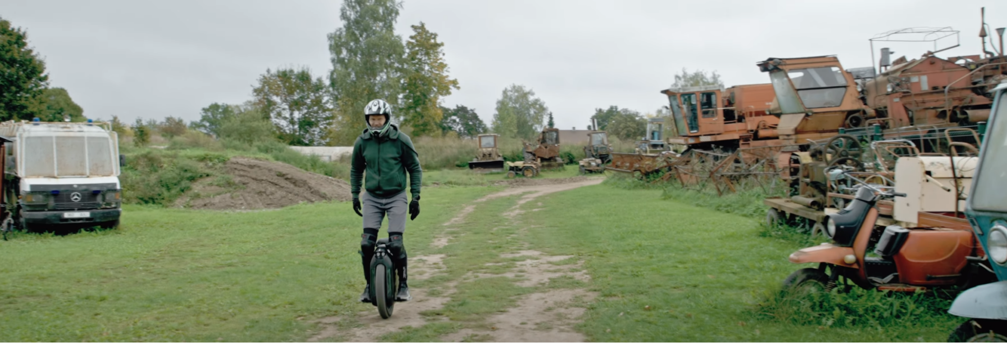 Mart riding the electric unicycle Gotway Monster Pro in a rural area.
